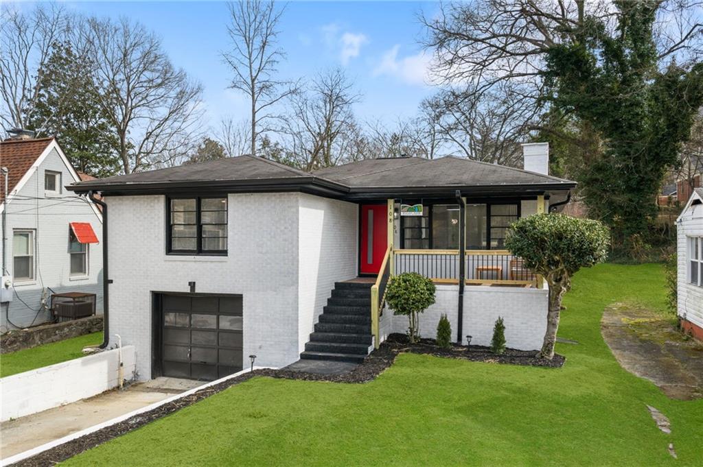 108 Burbank Drive Southwest Atlanta, GA 30314 - Photo 6 of 53 a front view of house with yard and green space