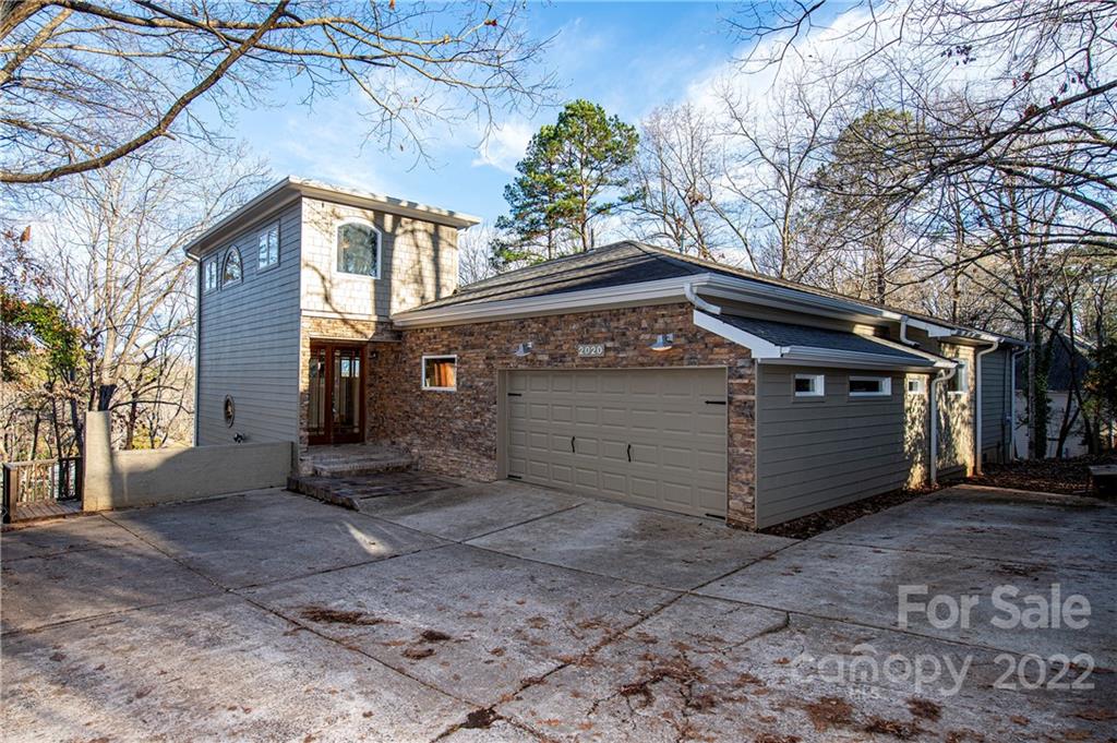 2020 Marquesas Avenue Tega Cay, SC 29708 - Photo 2 of 48 a view of a house with a yard