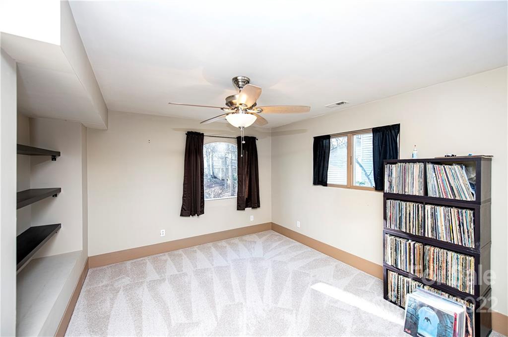 2020 Marquesas Avenue Tega Cay, SC 29708 - Photo 26 of 48 a view of an empty room with stairs and a window