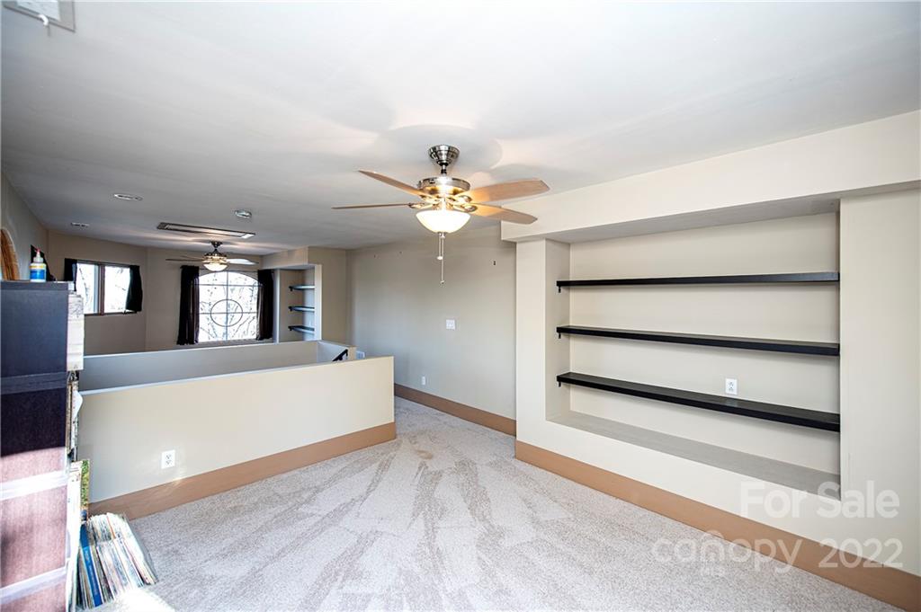 2020 Marquesas Avenue Tega Cay, SC 29708 - Photo 27 of 48 a living room with furniture and a chandelier