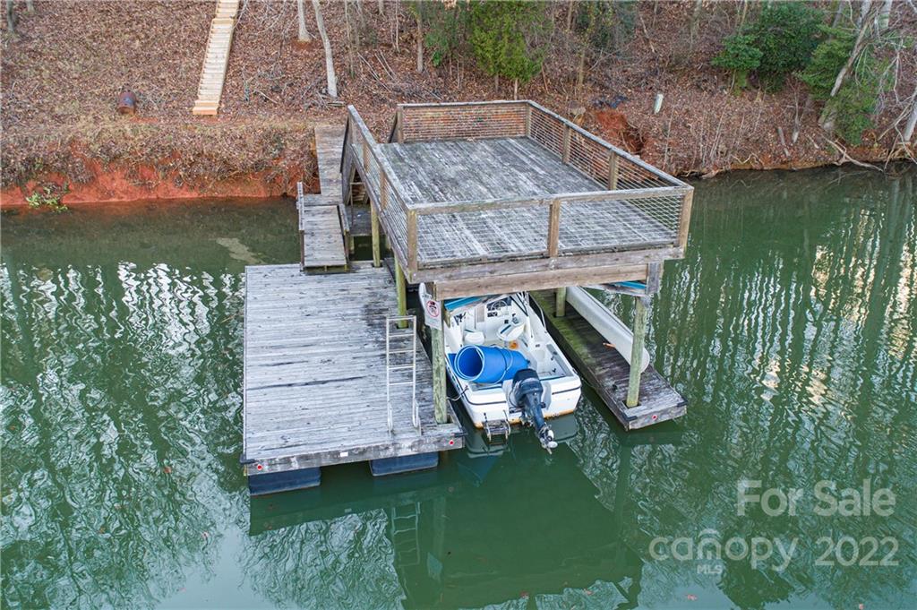2020 Marquesas Avenue Tega Cay, SC 29708 - Photo 3 of 48 a view of a wooden deck and a lake view