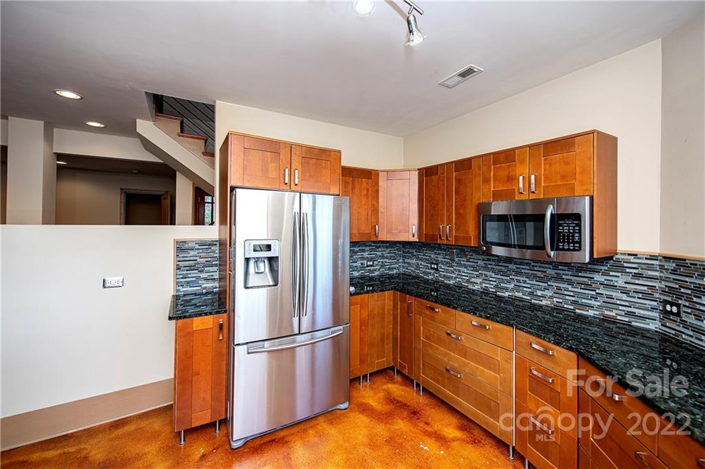 2020 Marquesas Avenue Tega Cay, SC 29708 - Photo 7 of 48 a kitchen with stainless steel appliances granite countertop a refrigerator a oven and a sink