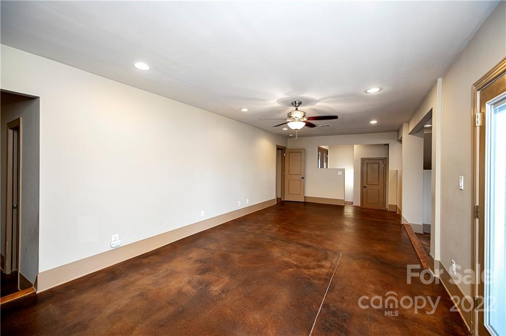 2020 Marquesas Avenue Tega Cay, SC 29708 - Photo 9 of 48 an empty room with wooden floor and windows