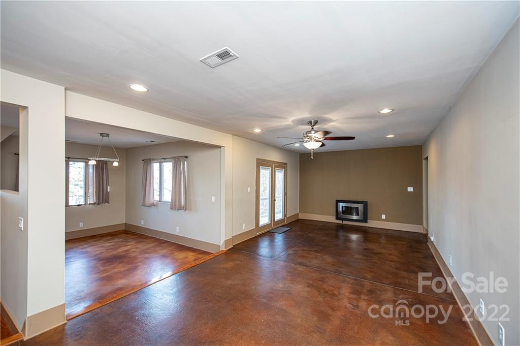 2020 Marquesas Avenue Tega Cay, SC 29708 - Photo 10 of 48 a view of an empty room with window and wooden floor