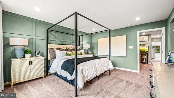 a bedroom with a bed window and a walk in closet