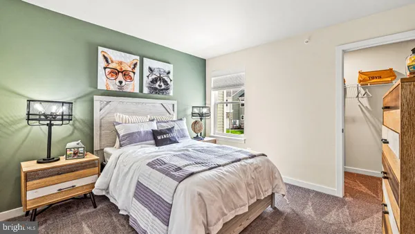 a bedroom with bed and a window