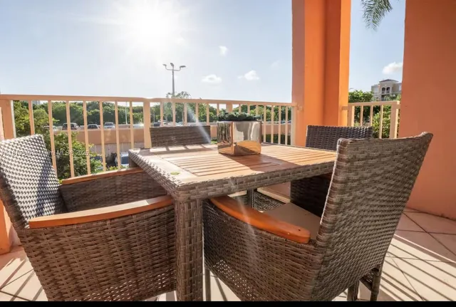 a view of an outside dining space with furniture
