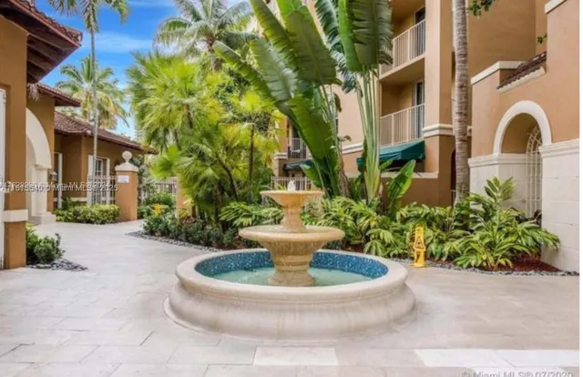 a view of a fountain in the patio of a house