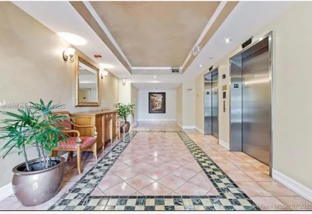 a hallway with a potted plant on a table