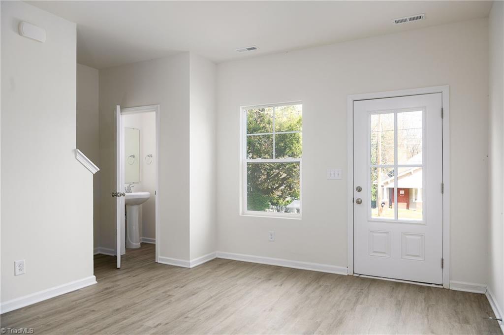 711 Fairview Street, Unit B High Point, NC 27260 - Photo 6 of 18 Living Room w/ Half Bath