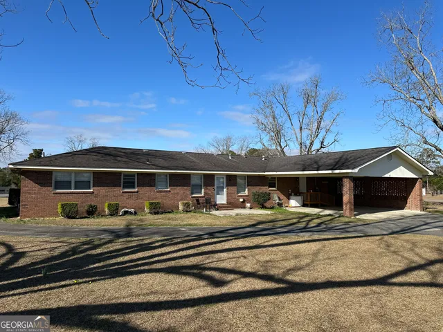 a front view of a house with a ocean view