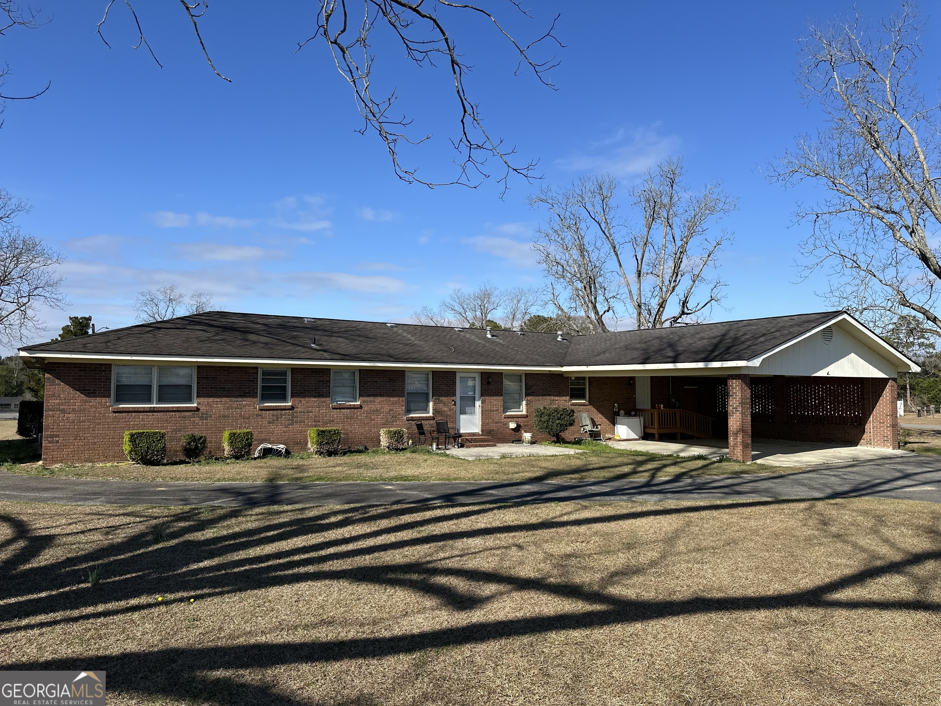 2808 Highway 117 Cadwell, GA 31009 - Photo 1 of 25 a front view of a house with a ocean view