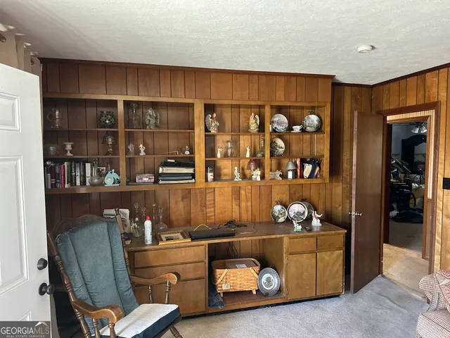 a room with gym equipment and a window