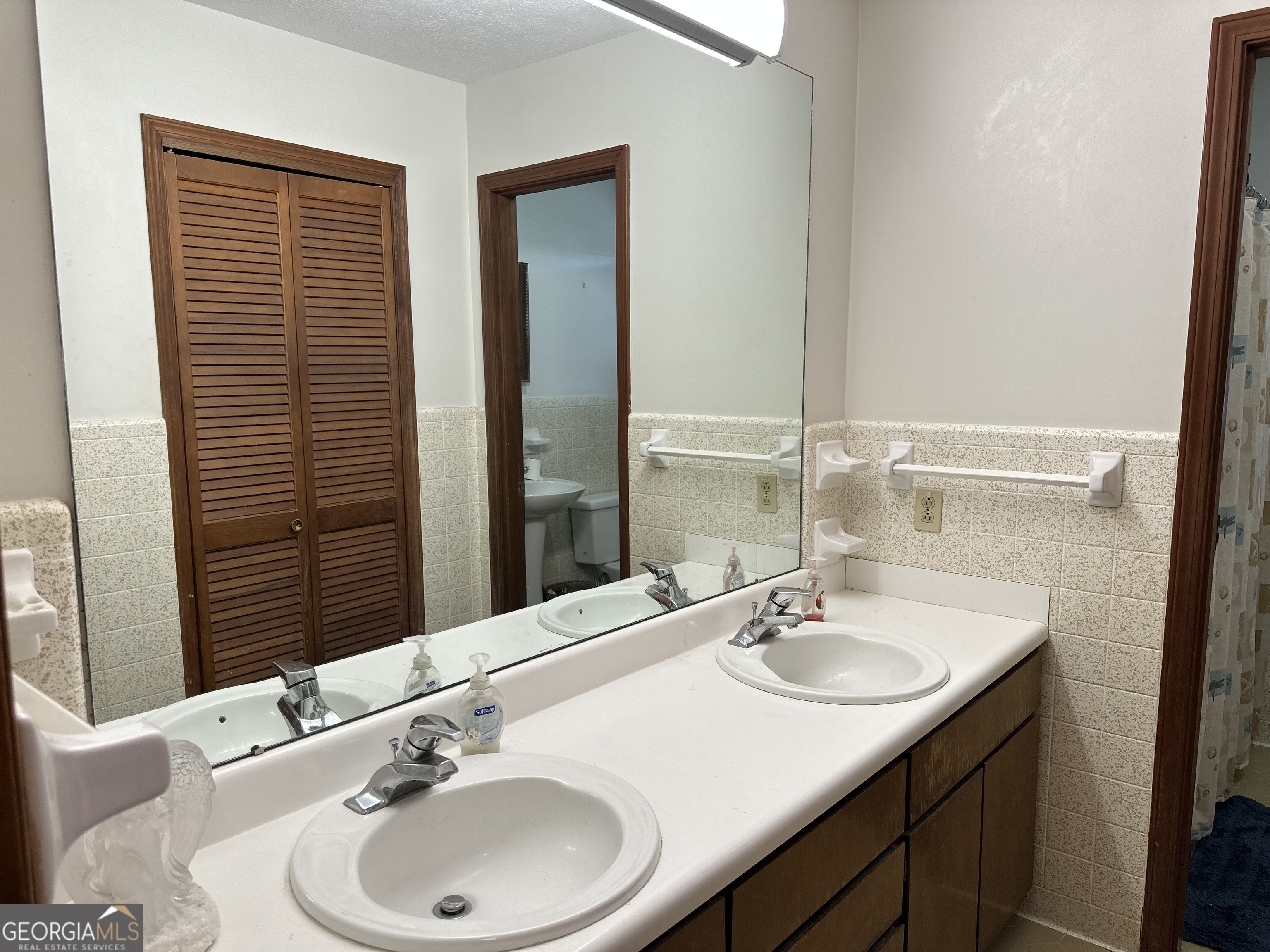 2808 Highway 117 Cadwell, GA 31009 - Photo 14 of 25 a bathroom with a sink and a mirror
