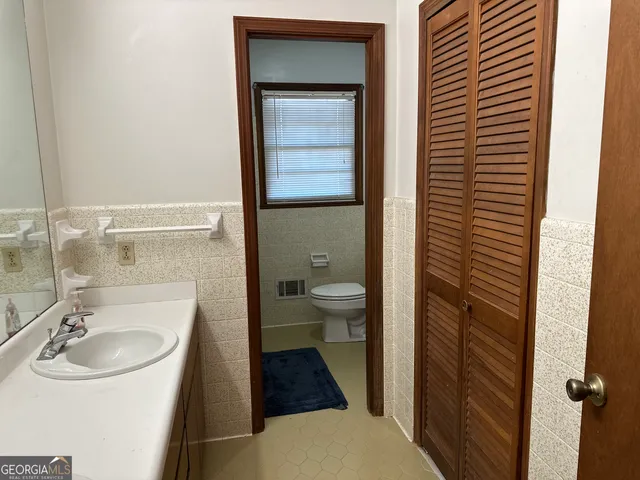 a view of living room with furniture and flat screen tv