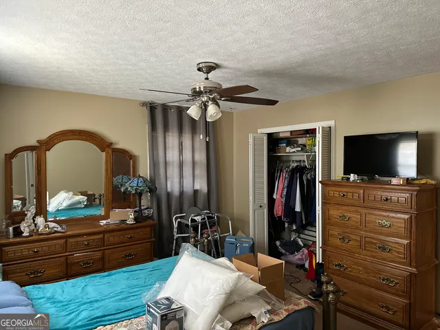 a view of a livingroom with furniture and a flat screen tv