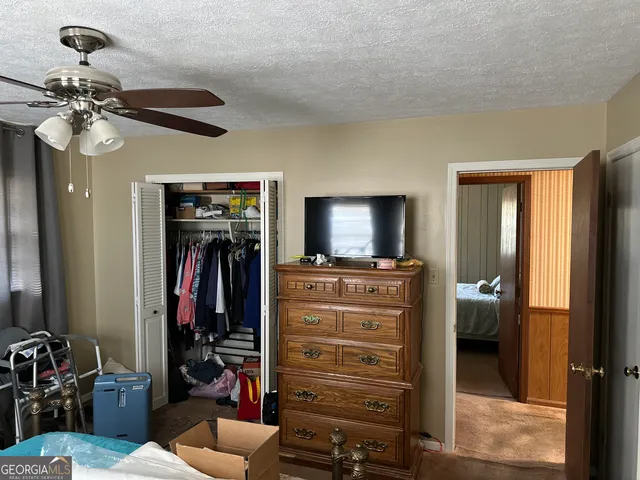a bathroom with a tub sink vanity and a mirror