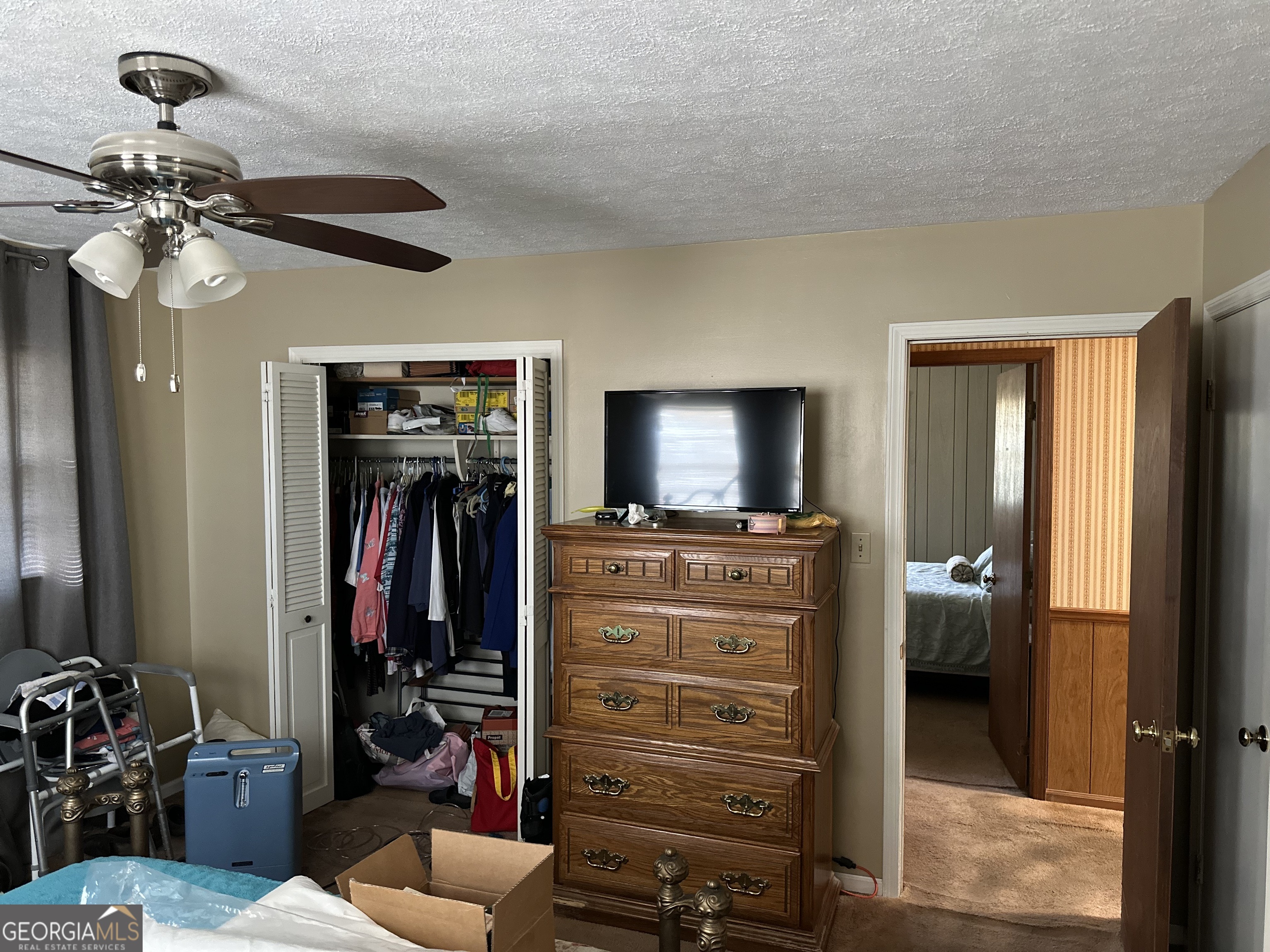 2808 Highway 117 Cadwell, GA 31009 - Photo 17 of 25 a view of a livingroom with furniture and a flat screen tv