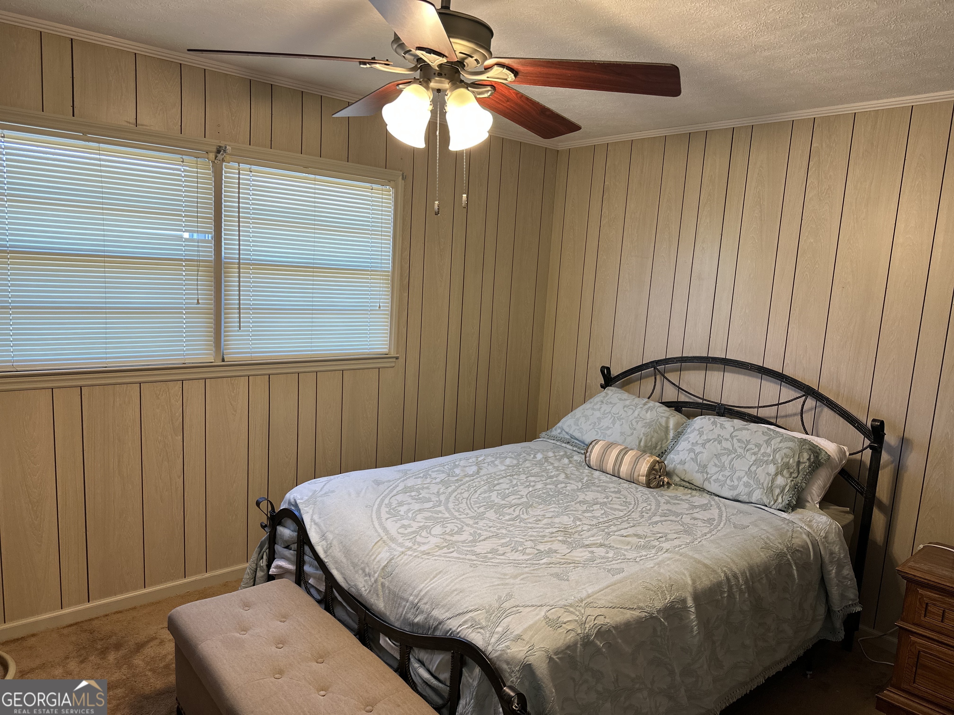 2808 Highway 117 Cadwell, GA 31009 - Photo 19 of 25 a bedroom with a bed and a chandelier