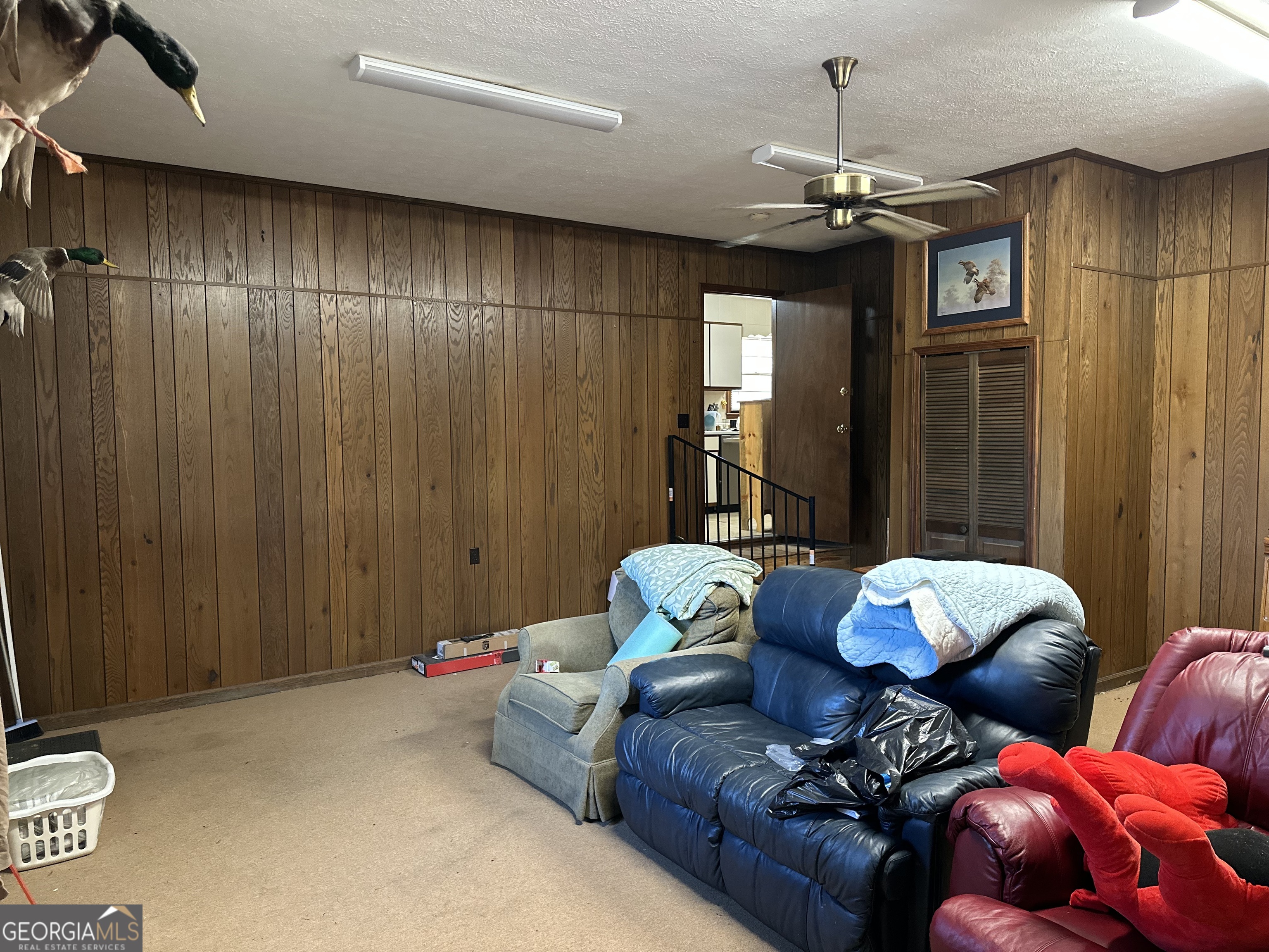 2808 Highway 117 Cadwell, GA 31009 - Photo 22 of 25 a living room with furniture and chandelier