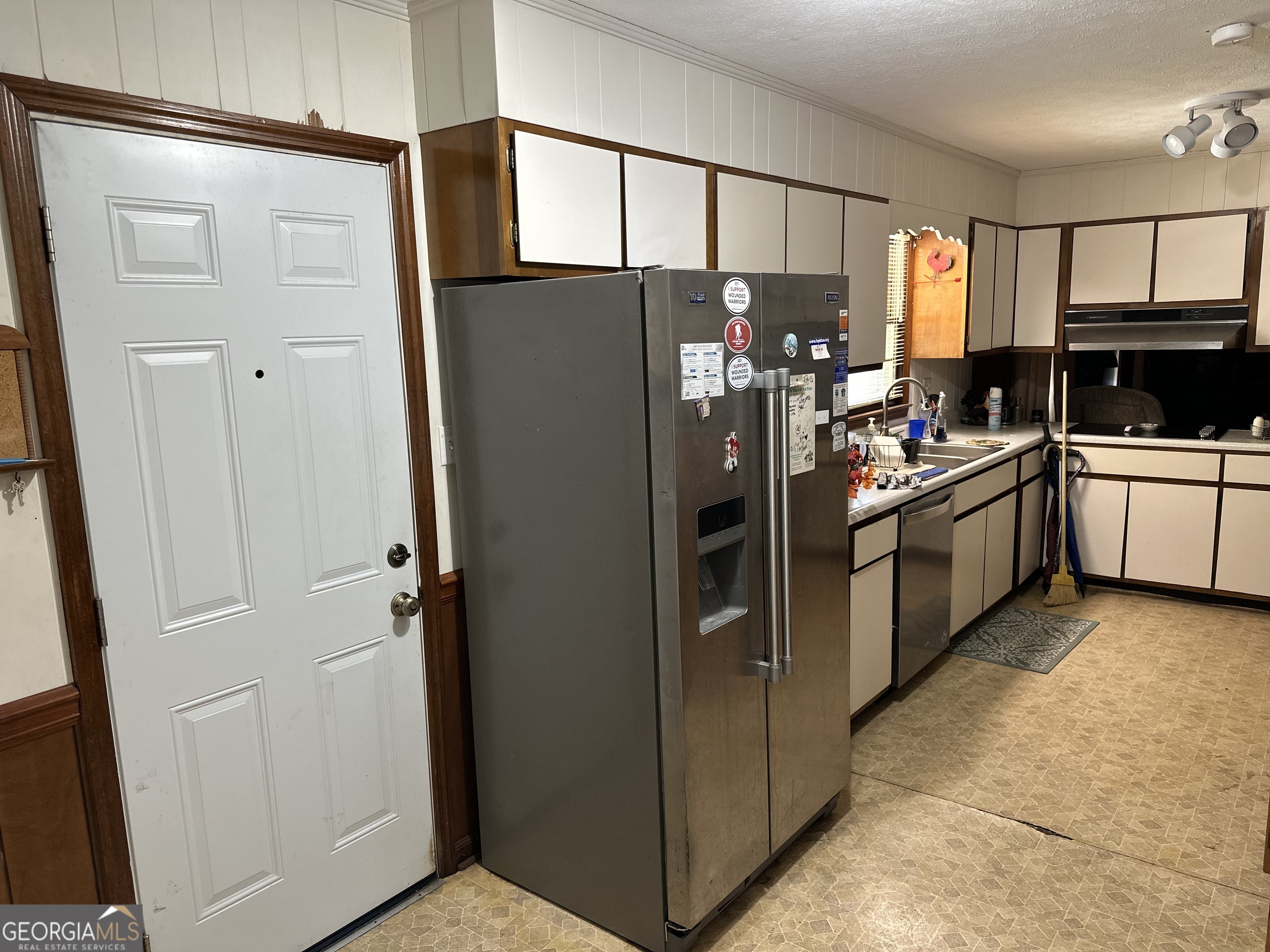 2808 Highway 117 Cadwell, GA 31009 - Photo 5 of 25 a kitchen with stainless steel appliances granite countertop a refrigerator and a stove top oven