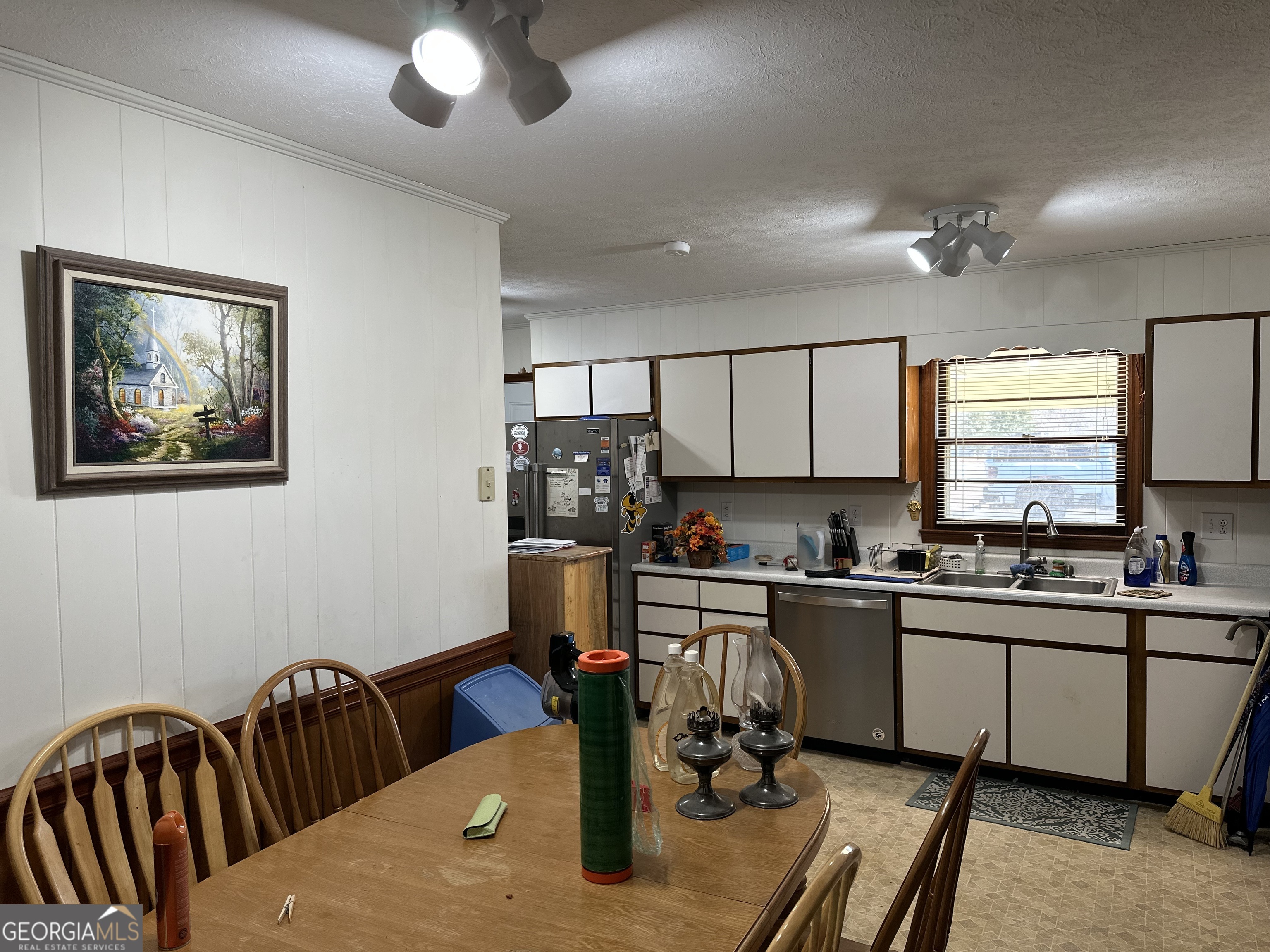 2808 Highway 117 Cadwell, GA 31009 - Photo 6 of 25 a kitchen with stainless steel appliances granite countertop a sink dishwasher a stove a refrigerator with wooden cabinets and floor