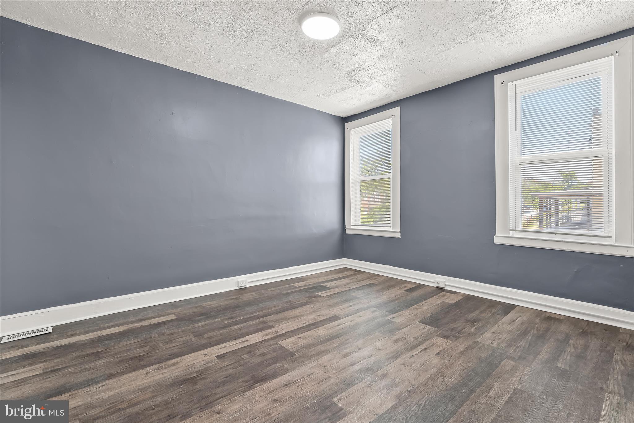 3534 Overview Road Baltimore, MD 21215 - Photo 20 of 28 a view of an empty room with wooden floor and a window