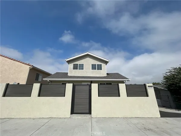 a front view of a house with yard