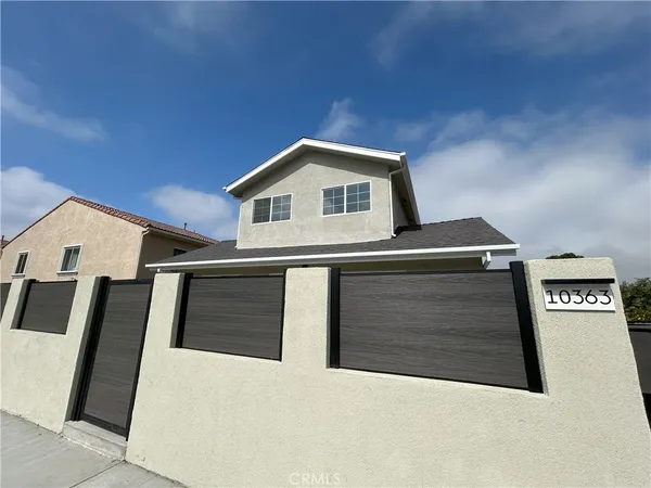 a front view of a house with garage