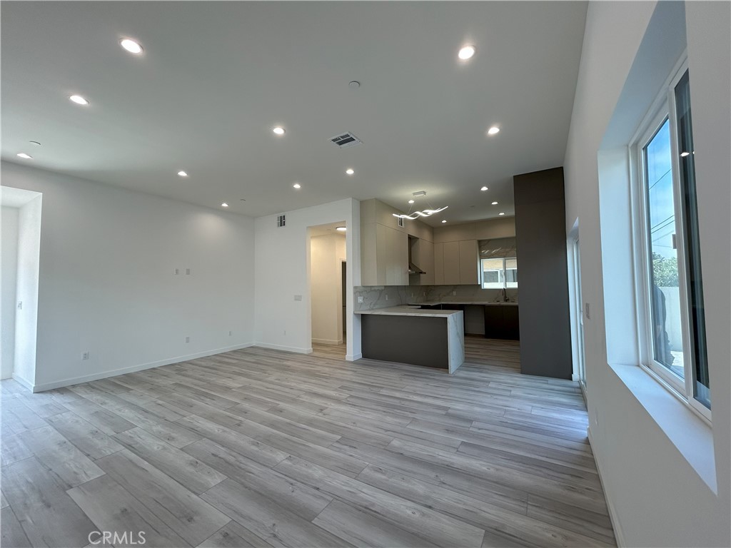 10363 Commerce Avenue Tujunga, CA 91042 - Photo 32 of 51 a view of kitchen with kitchen island wooden floor center island and stainless steel appliances
