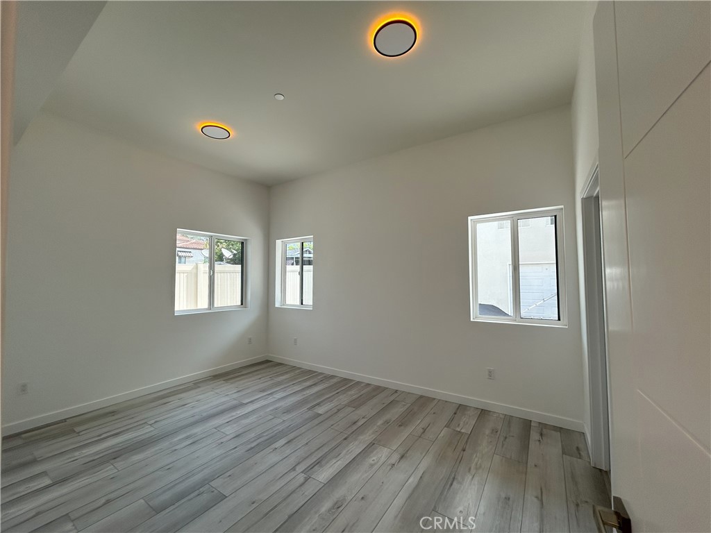 10363 Commerce Avenue Tujunga, CA 91042 - Photo 33 of 51 an empty room with a empty space and windows