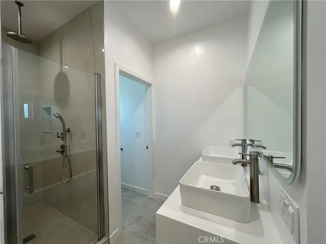 a bathroom with a sink and shower