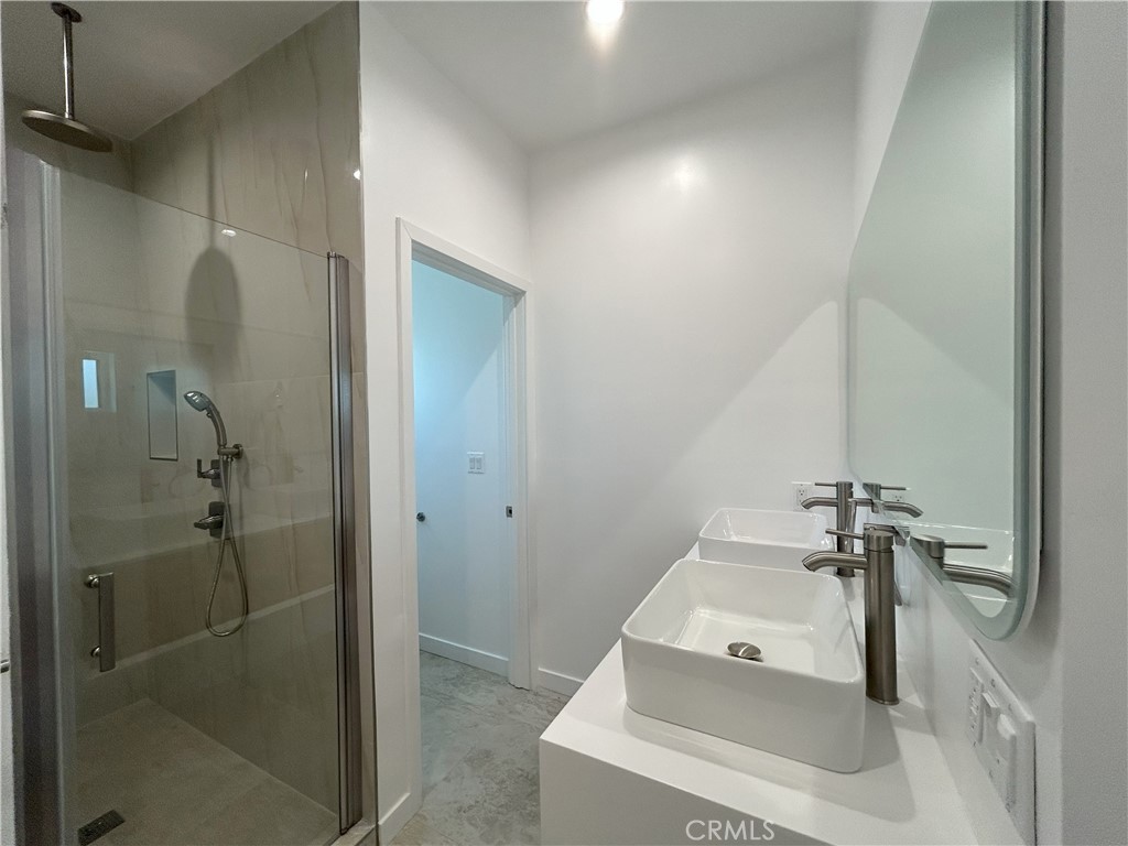 10363 Commerce Avenue Tujunga, CA 91042 - Photo 40 of 51 a bathroom with a sink and shower