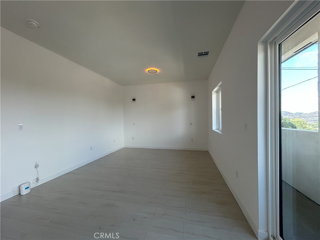 10363 Commerce Avenue Tujunga, CA 91042 - Photo 42 of 51 an empty room with windows