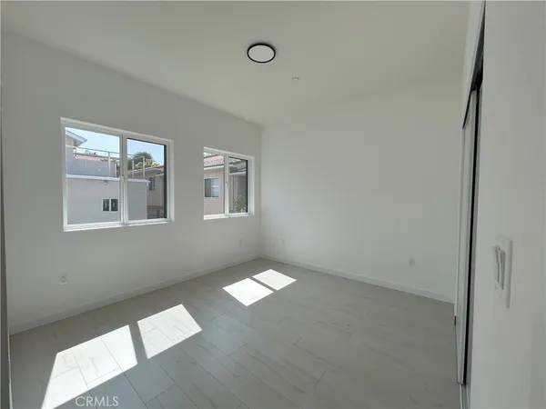 a view of an empty room with windows