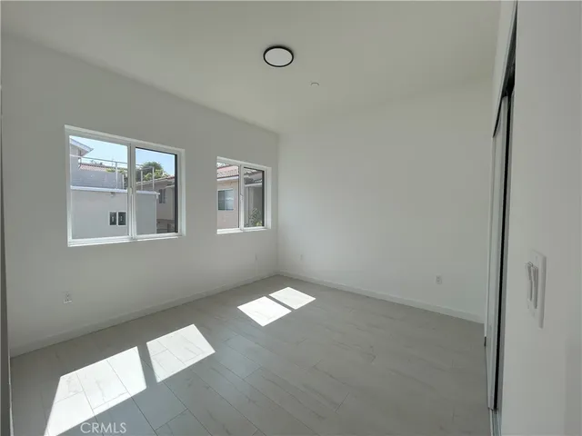 a view of an empty room with windows