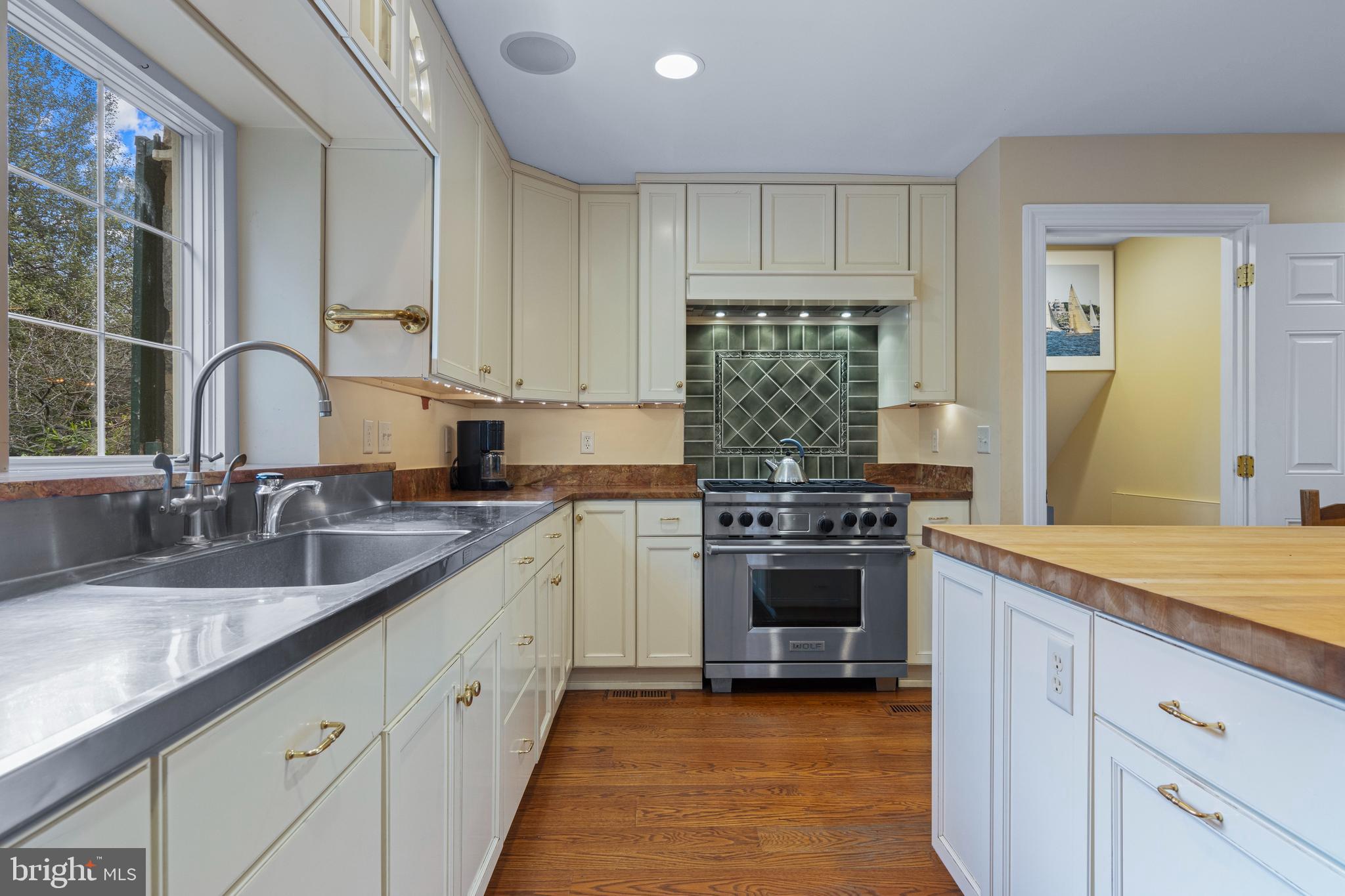 331 Fishers Road Bryn Mawr, PA 19010 - Photo 16 of 64 a kitchen with stainless steel appliances granite countertop a sink stove and cabinets