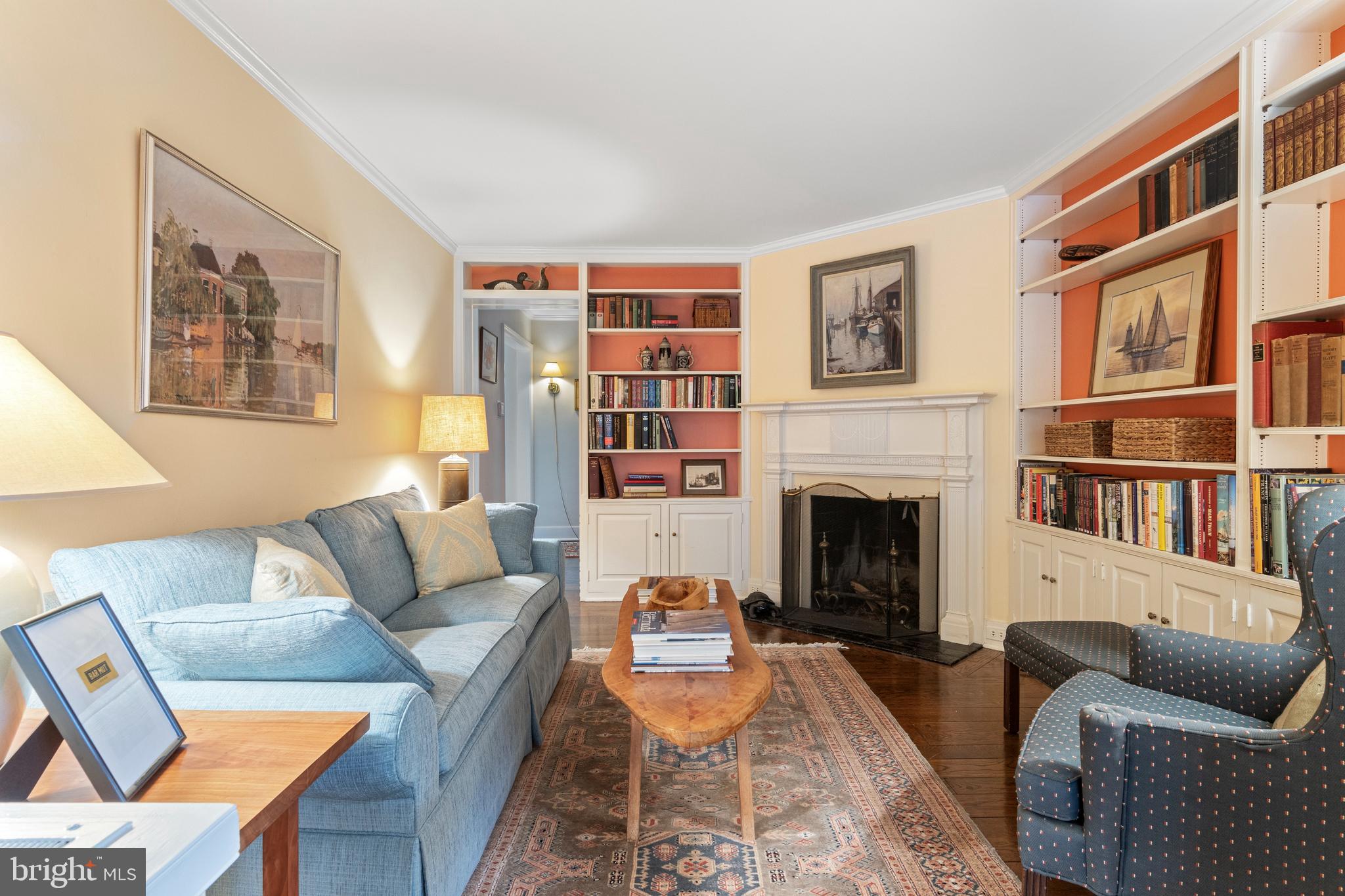 331 Fishers Road Bryn Mawr, PA 19010 - Photo 25 of 64 a living room with furniture a fireplace and a book shelf