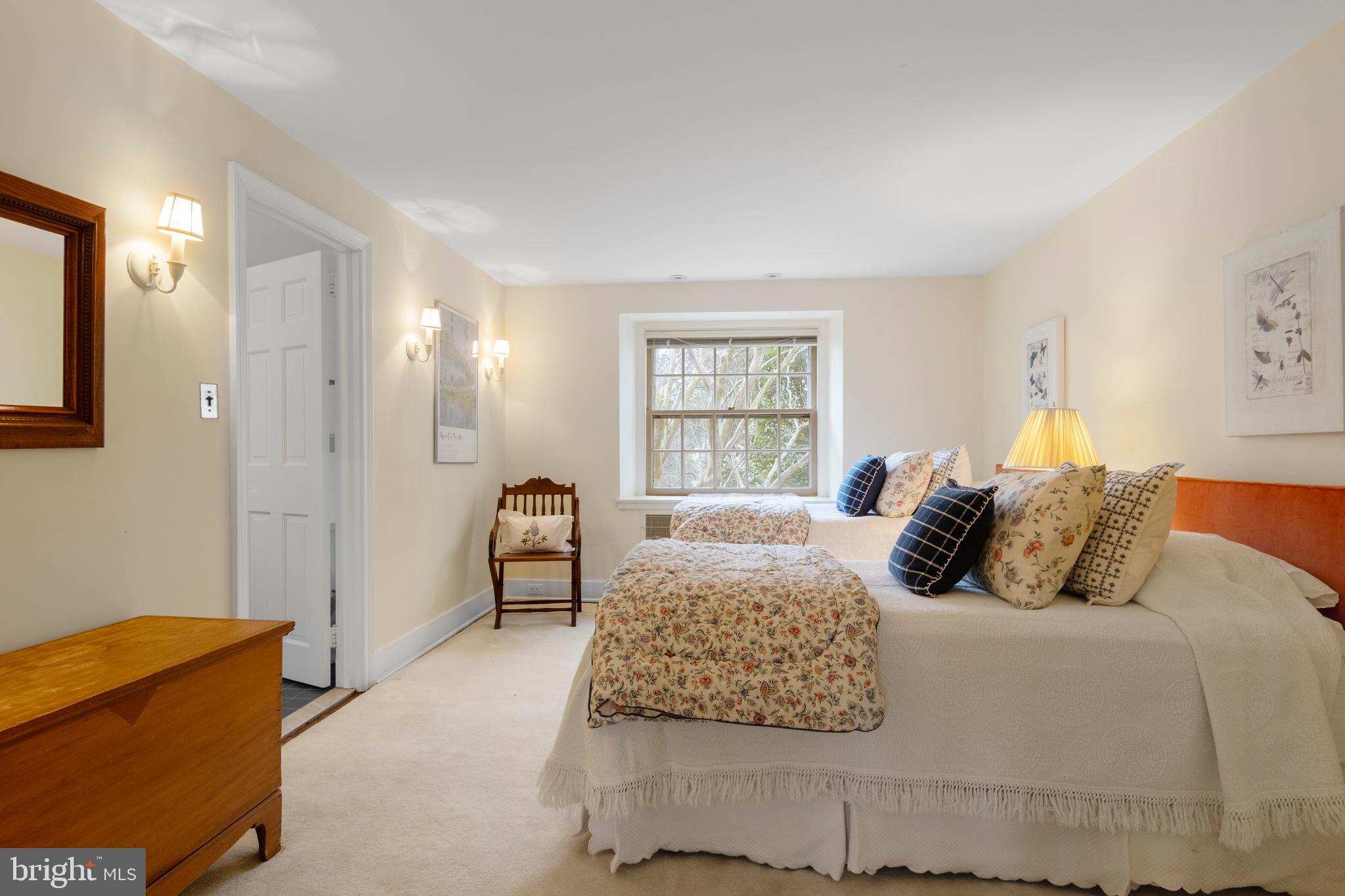 331 Fishers Road Bryn Mawr, PA 19010 - Photo 37 of 64 a bedroom with a bed and a couch with window