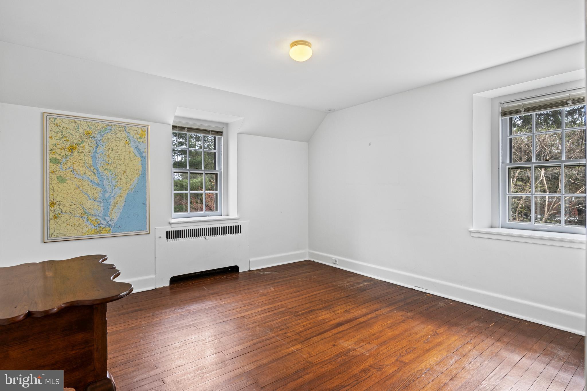 331 Fishers Road Bryn Mawr, PA 19010 - Photo 44 of 64 a view of an empty room with wooden floor and a window
