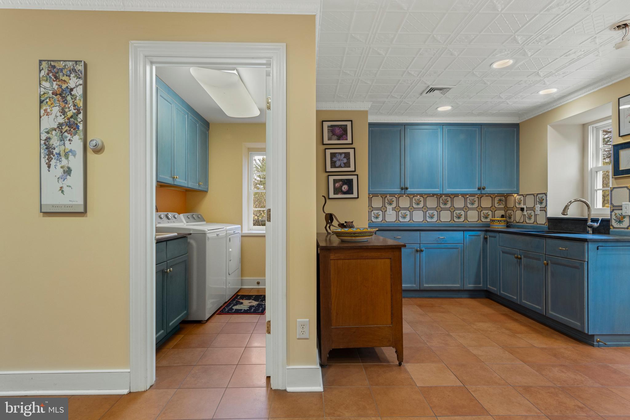 331 Fishers Road Bryn Mawr, PA 19010 - Photo 50 of 64 a kitchen with a refrigerator and cabinets