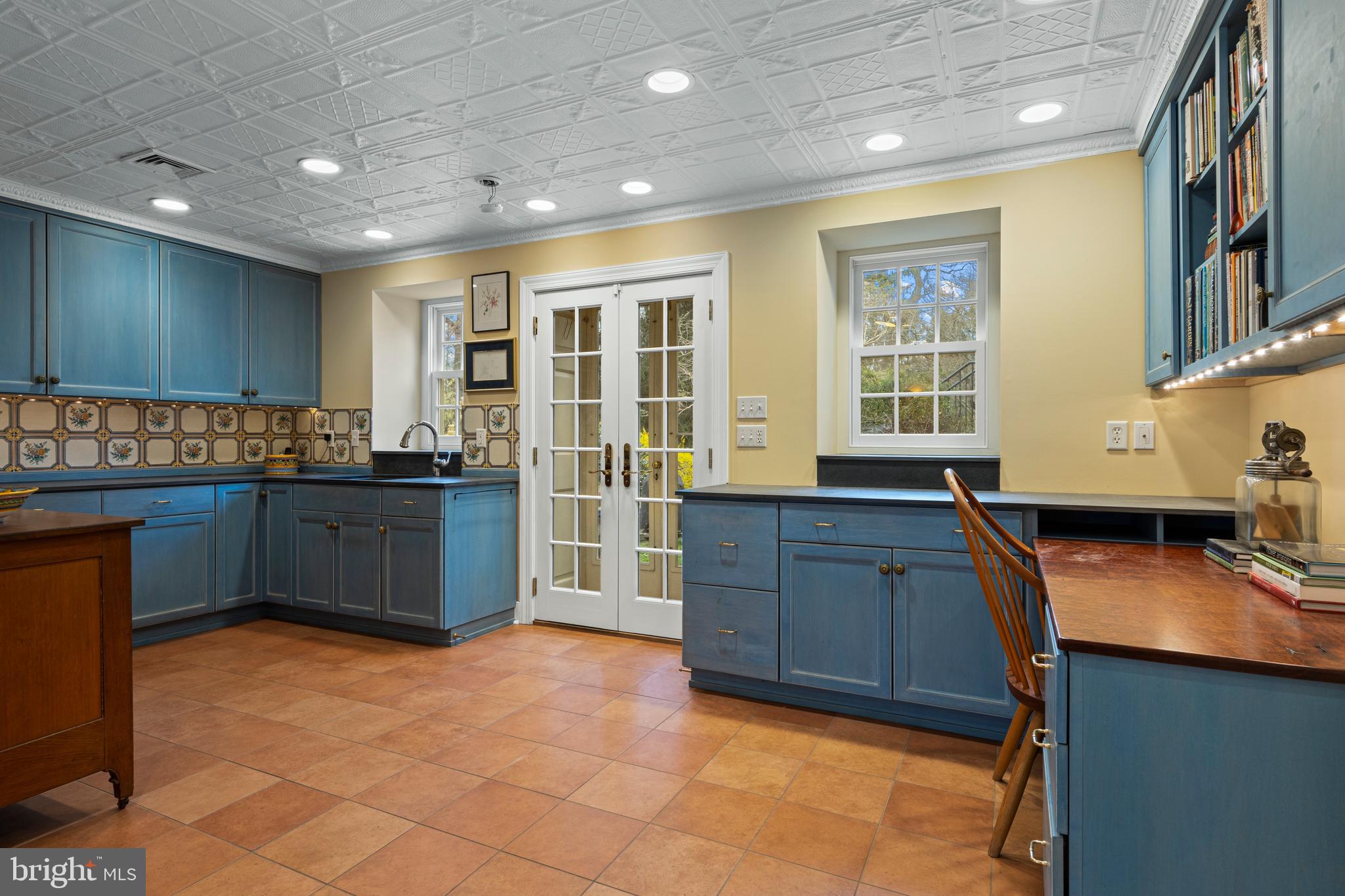 331 Fishers Road Bryn Mawr, PA 19010 - Photo 53 of 64 a kitchen with granite countertop a stove a sink a dining table and chairs