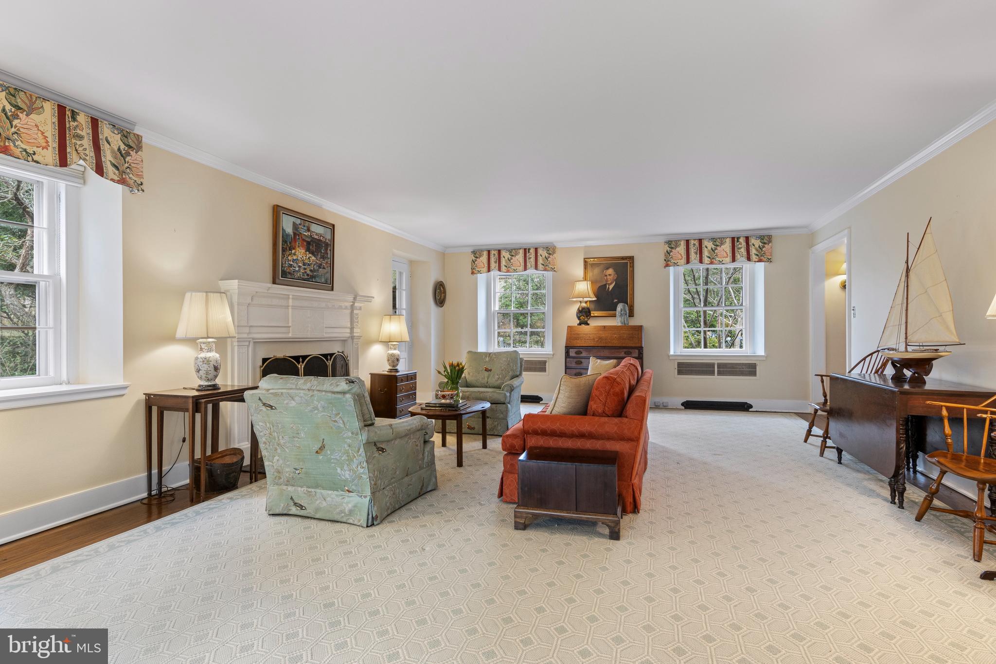 331 Fishers Road Bryn Mawr, PA 19010 - Photo 9 of 64 a living room with furniture and a fireplace