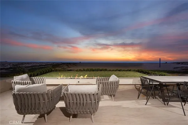 a view of a roof deck with couches