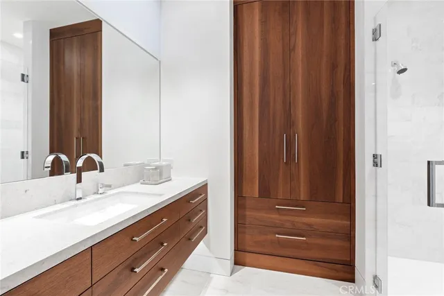 a bathroom with a double vanity sink and a mirror