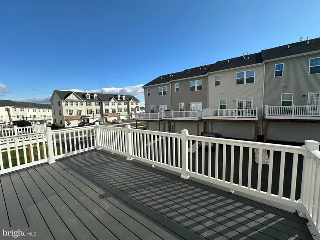 a view of a wooden balcony with city view