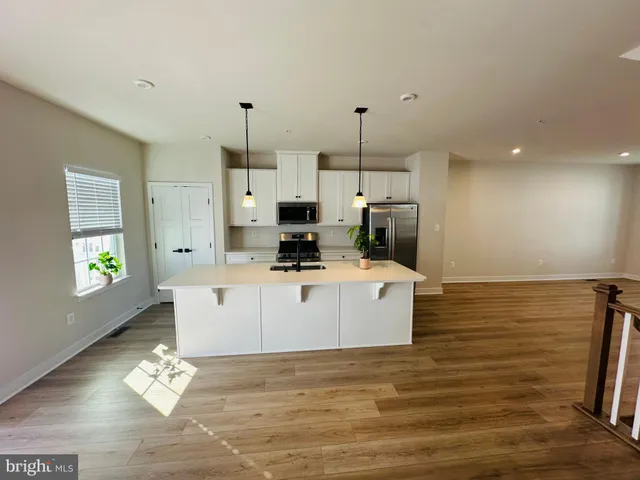 a view of a kitchen counter space a sink and dishwasher