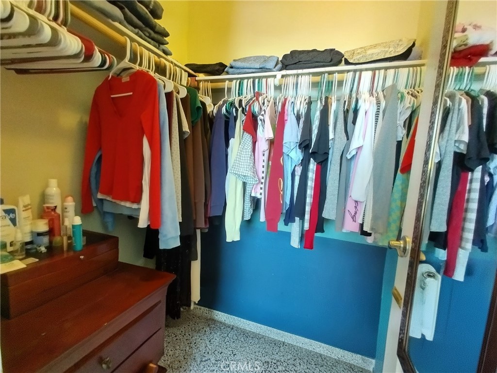 11811 Cramer Road Yucaipa, CA 92399 - Photo 39 of 56 a view of walk in closet with clothes