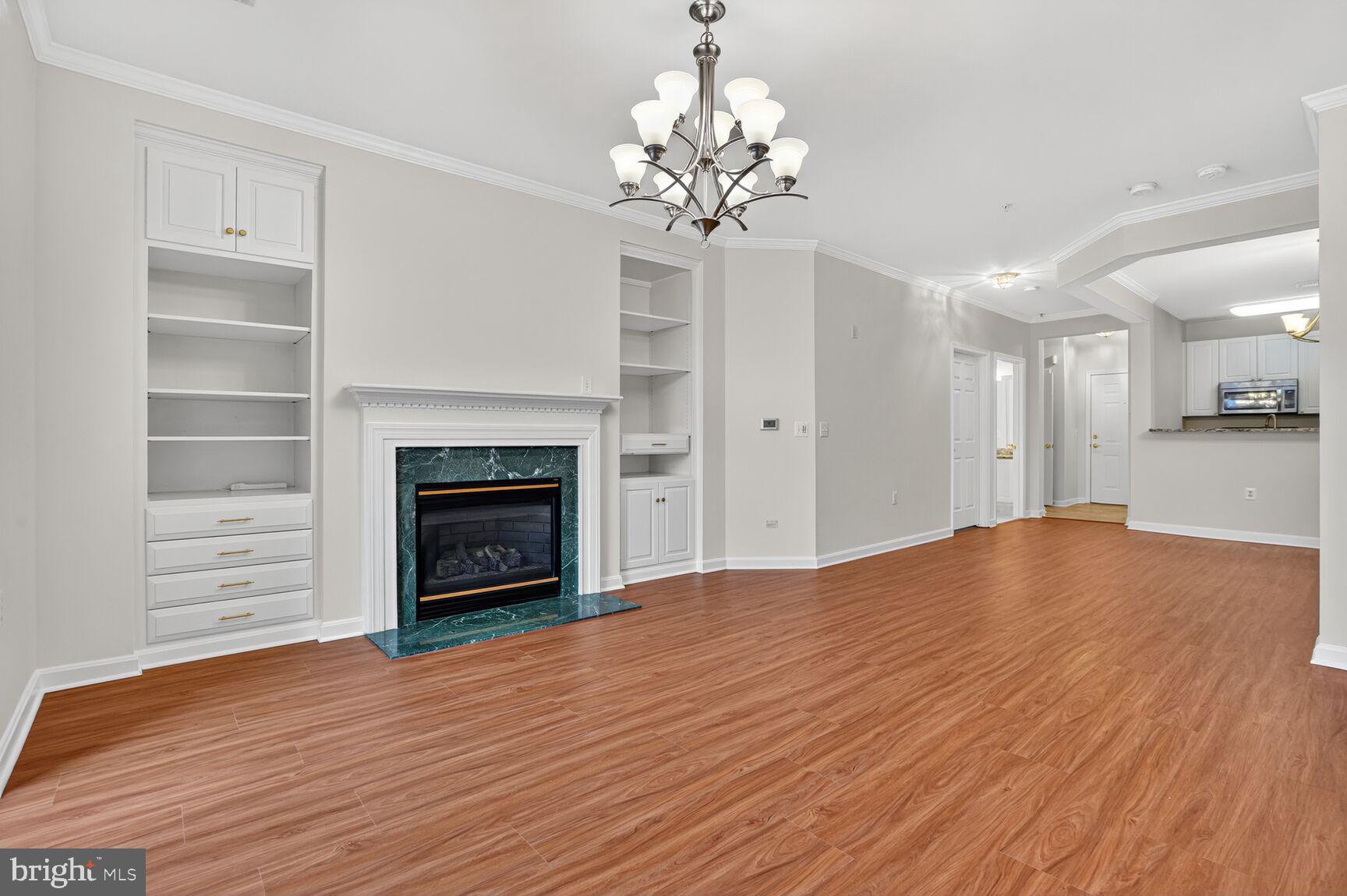 a view of a room with an empty room and a fireplace