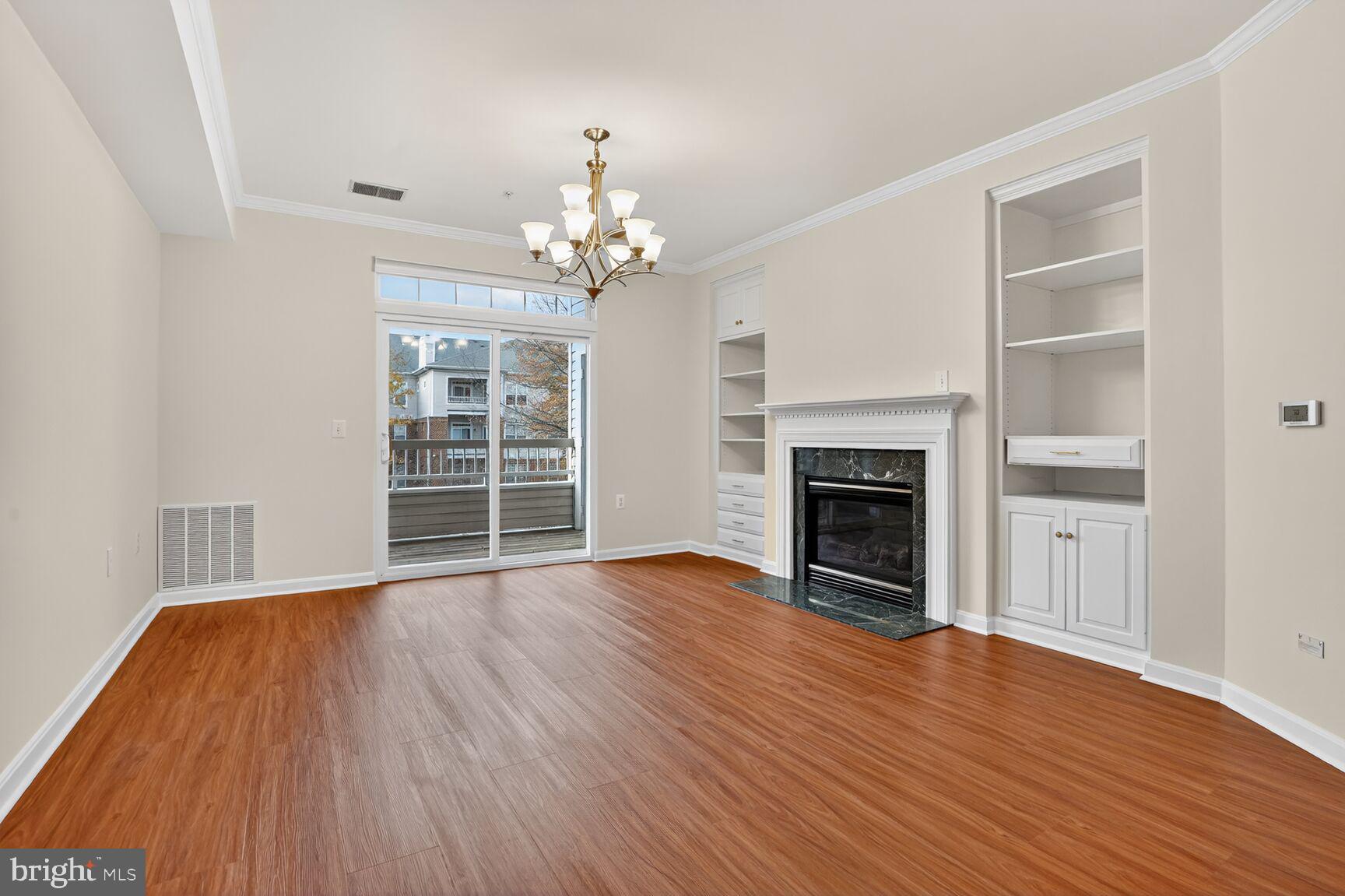 4300 Cannon Ridge Court, Unit 14 Fairfax, VA 22033 - Photo 4 of 23 wooden floor fireplace and windows in an empty room